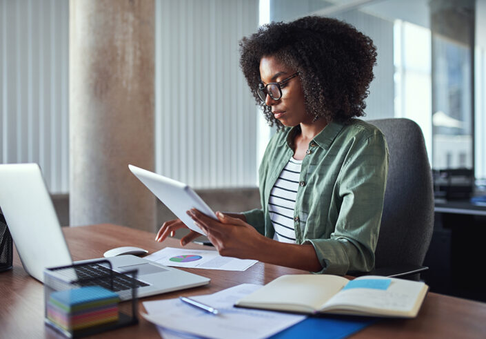 Woman looking at report