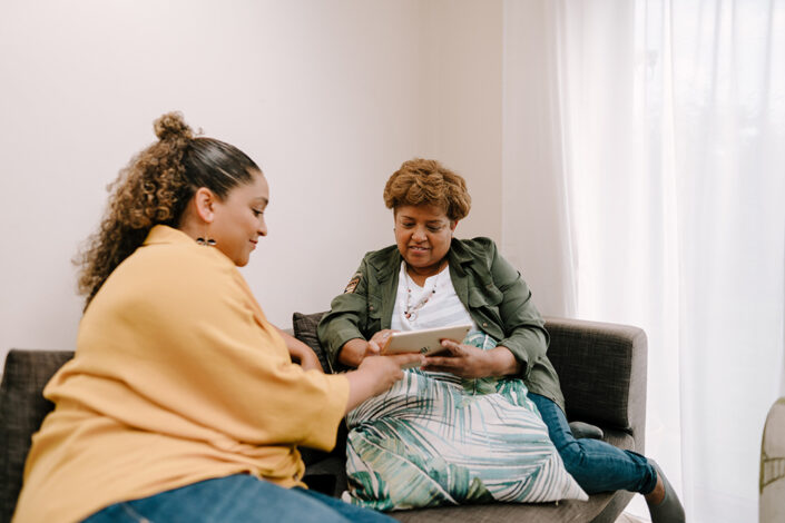 Women talking on a sofa