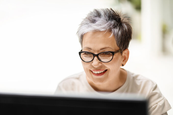 Woman looking computer screen