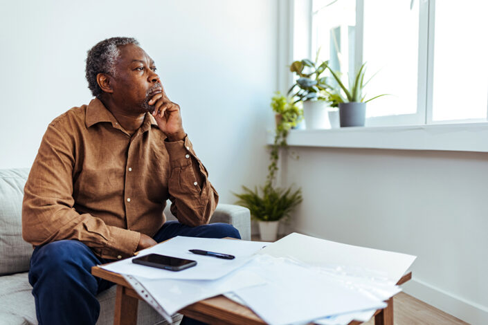 Senior man with paperwork