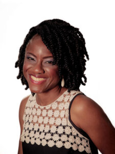 Photo of Funke Oham, Cabinet Office Grief Cafe wearing a cream and black top