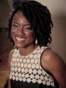 Photo of Funke Oham, Cabinet Office Grief Cafe wearing a cream and black top