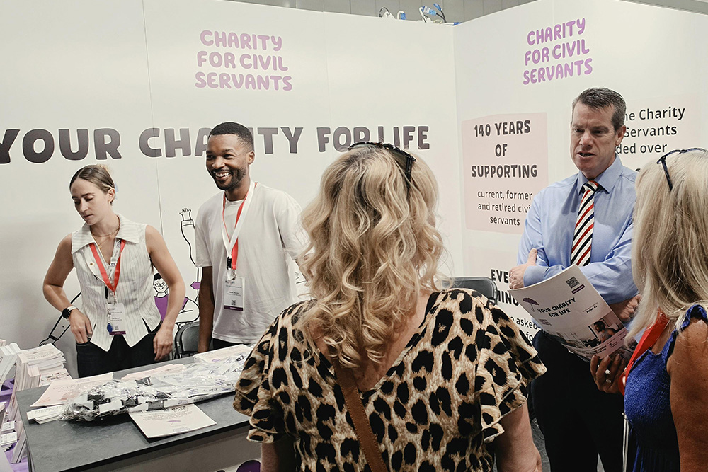 Members of staff from the Charity for Civil Servants at the stand at Civil Service Live London
