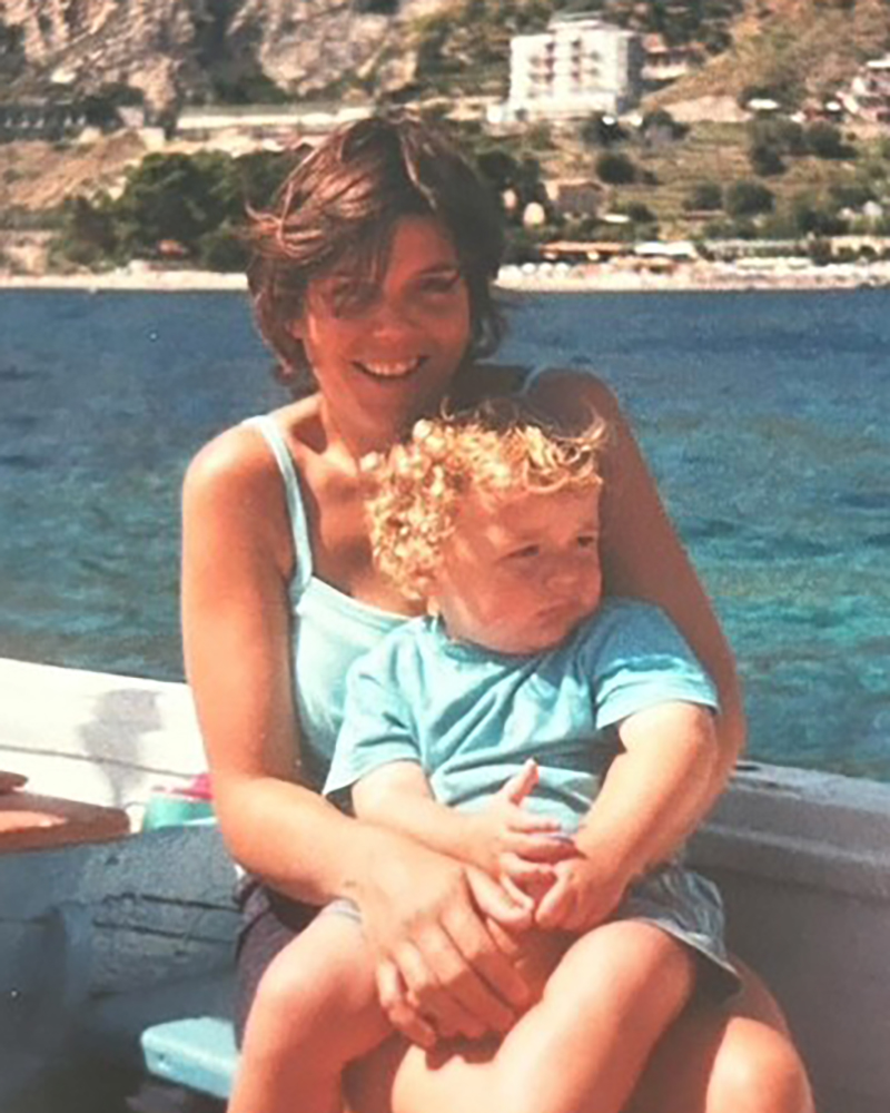 Photo of Lorna with Sean aged about three sitting on her lap