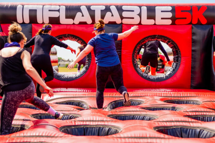 Photo of three people taking on the Inflatable 5k challenge
