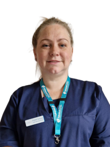 Photo of Liz Tomlinson Dementia UK wearing a blue top